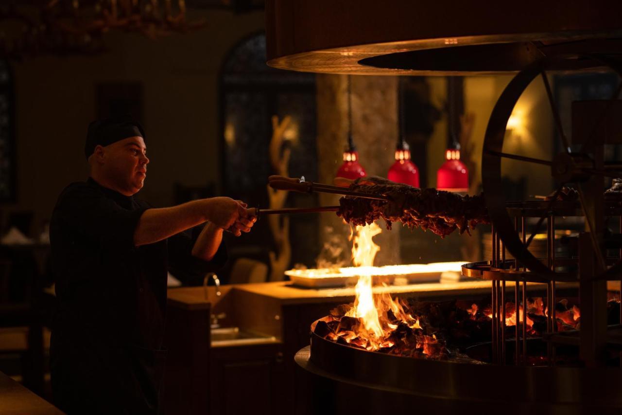 Отель The Mora Zanzibar Матемве Экстерьер фото A chef cooking over a wood-burning grill