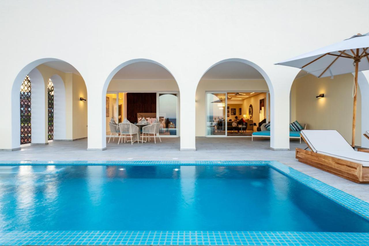 Отель The Mora Zanzibar Матемве Экстерьер фото A pool at the hotel