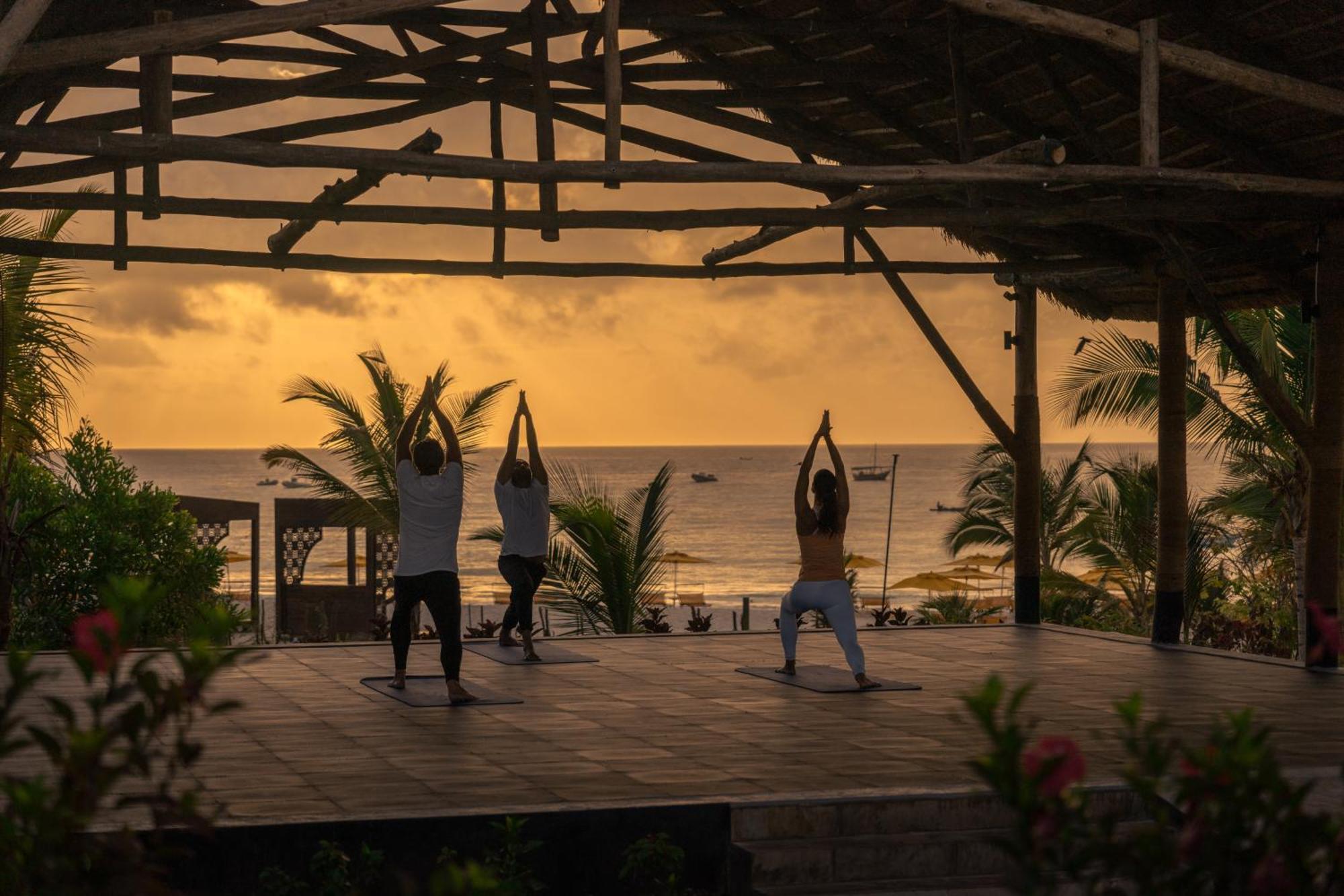 Отель The Mora Zanzibar Матемве Экстерьер фото Sunset yoga at the beach