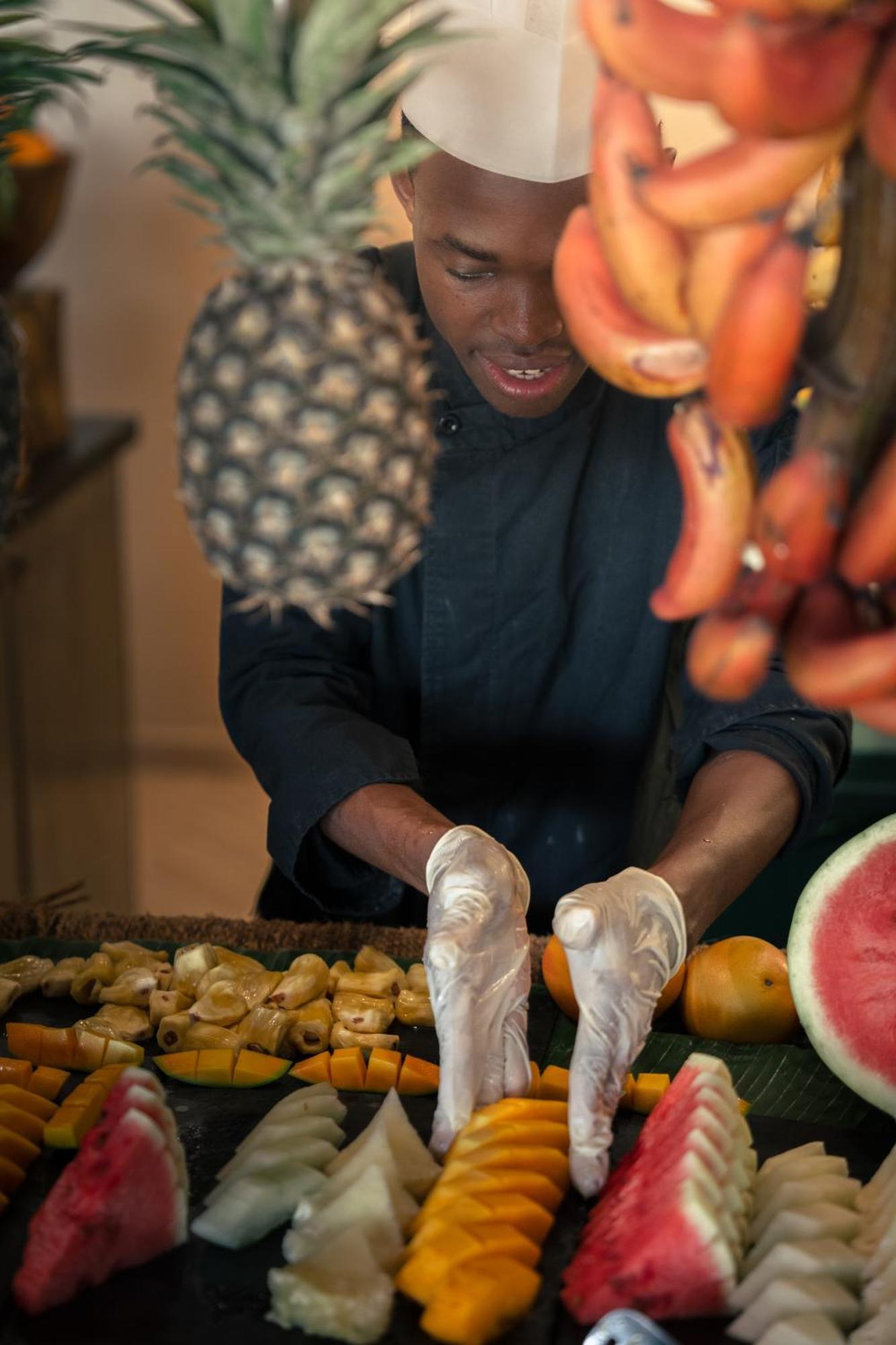 Отель The Mora Zanzibar Матемве Экстерьер фото A chef preparing fruit